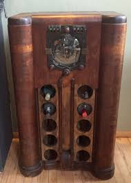 Old Radio Repurposed Into A Wine Bottle Holder Antique Radio Cabinet How To Antique Wood Old Radios