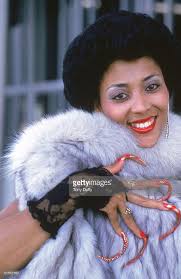 Florence Griffith Joyner poses for a portrait in 1986.