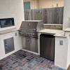 Because it's a covered space, it's able to also incorporate a comfortable outdoor living area complete with flat screen tv (great for hosting during sporting events or alfresco movie nights). 3