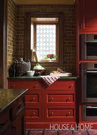 Appliances and kitchen cabinets must work together to create a pleasing and functional kitchen design. 30 Dark Moody Kitchens That Are Totally Dreamy Red Kitchen Cabinets Basement Decor Diy Finish Basement