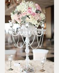 Be inspired by our best ideas whether you use pillars, votives, tapers, or tea lights to achieve a beautiful ambience. Wedding Flowers Tall Wedding Centerpieces Candelabra Wedding Chandelier Centerpiece