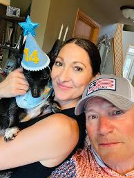 We think he's 14. we got him 12 years ago. It's Ty's “Gotcha day” he's a  babied baby. And dont worry i made her take this off him right after the  photo op!