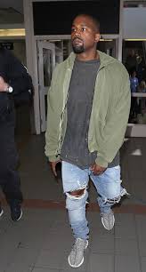 Since publishing this story, kanye has worn the black velvet crewneck sweatshirt and maroon hoodie at paris fashion week yet again, bringing their appearances to six and seven, respectively. Kanye West Spotted At Lax Wearing Yeezus Hoodie Maison Margiela Pants Yeezy Boots Airport Style History Yeezus Hoodie Kanye West Style Kanye Fashion