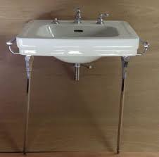 The toilet table is provided with a manicure bowl. Vintage White Porcelain Bathroom Sink Chrome Brass Legs Towel Bars Vintage Sink Porcelain Bathroom Sink Sink