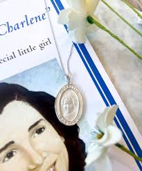 These beautiful necklaces of Charlene Richard, “the little Cajun saint”,  are unique to our Acadiana community😇🤍 necklaces with a medal of Charlene  are available in sterling silver and pewter! #shopcrossroads  #catholiccharities #crossroadscollective #