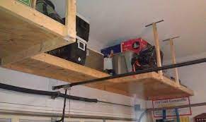Which Is A Better Overhead Garage Storage System For You A Shelf Is Good But Generally You W Garage Storage Shelves Garage Ceiling Storage Diy Garage Storage