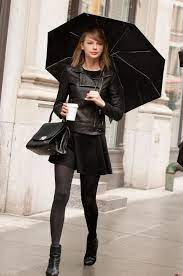 Taylor Swift Wearing Black Leather Biker Jacket Black Skater Dress Black Leather Ankle Boots Black Leather Satchel Bag Black Skater Dress Fashion Leather Jacket Black