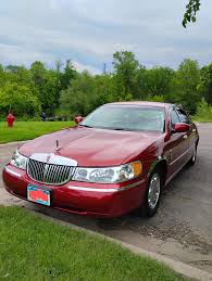 Image result for Toreador Red 1999 Town Car