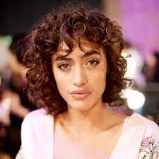 Here is a high, tight, and ultra voluminous cut for women who want low maintenance short curly hairstyles. 40 Stunning Ways To Rock Curly Hair With Bangs