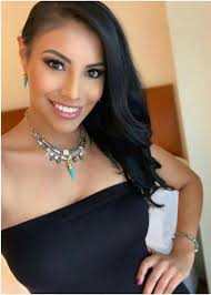 An adorable Native American in full native dress.