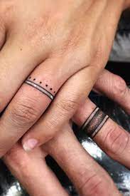 26 Sweet Wedding Ring Tattoo Ideas Tattoo Wedding Rings Wedding Ring Tattoo Ring Tattoo Designs