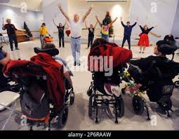 Gary Kirtley leads the group in dancing to "Y.M.C.A."