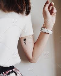The designs are basic, elegant and divine. Small Tattoo Stock Photo 8caf8e68 Bd97 4be2 9b72 65d971a0d9fd