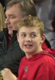 Kirby Smart and the family courtside at Georgia vs. Kentucky. Andrew Smart  having too much fun to care about whatever Dad is showing him