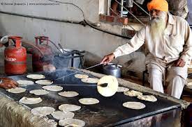 Cooking In Progress Making Of Roti Indian Bread At The Golden Temple Kitchen Golden Temple Incredible India Indian Bread