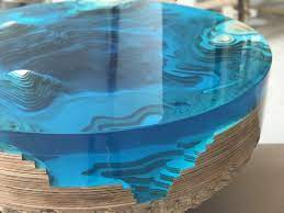 The table top is made of solid walnut wood and blue color pigments colored with epoxy resin. Designers Creative Design Unique Blue Ocean Abyss Table Diy Epoxy Resin Plywood Round Coffee Table Epoxy Crafts Resin Tables Epoxy Resin Table