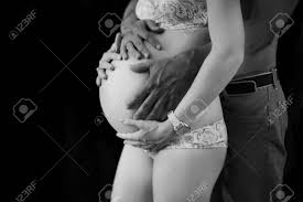 Check spelling or type a new query. Pregnant Couple S Cuddles Mixed Marriage Black And White Photo Stock Photo Picture And Royalty Free Image Image 140233223