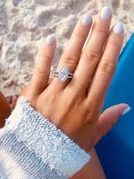 Marquise Diamond Engagement Ring With A Diamond Halo And Split Shank Marquise Diamond Engagement Ring Engagement Rings Diamond Engagement