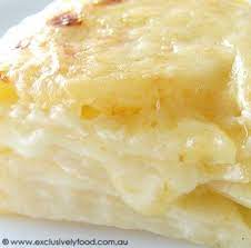 Creamy Potato Bake With Cream Milk Garlic Cloves Potatoes Salt Ground White Pepper Cheddar Cheese Creamy Potato Bake Recipes Creamy Potato