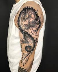 A breathtaking dragon inked on men with two paws. Traditional Japanese Tattoos Irezumi Cloak And Dagger Tattoo London