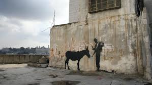 It was painted during the days and was filmed so banksy was not arrested by israelian soldiers. O Come All Ye Faithful Banksy In Bethlehem 10 Years On The National