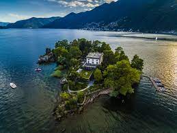 switzerland s secret island life 11 swiss islands to visit and fall in love with islands to visit beach trip travel switzerland