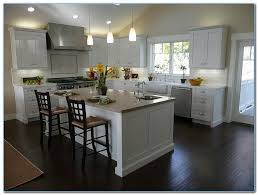 white cabinets and dark floors