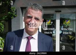 Peter Keohane, principal at Donahies Community School, Dublin, outside the  school as former pupils collect their