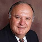 Dr. Stuart T. May, MD