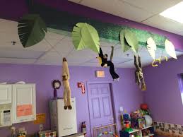 Stuffed Monkeys And A Snake Hanging From Ceiling Monkey Decorations Monkey Room Summer Home Decor