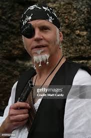 Pat Sargent, dressed as a pirate, poses for a photograph, as people... News  Photo