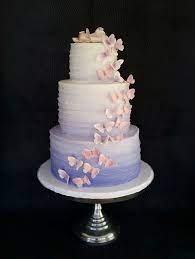 Lavender Ombre Buttercream Cake With Butterfly Cascade And Fondant Baby Topper Butterfly Baby Shower Cake Butterfly Baby Shower Theme Butterfly Birthday Cakes