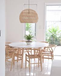 Beachy game room features a ping pong table placed in front of blue barstools positioned at a floating countertop mounted beside glass doors. 17 Most Inspiring Coastal Dining Rooms Dining Table Marble Coastal Dining Room Lights Over Dining Table