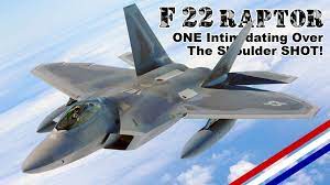 One Intimidating F 22 Raptor Over The Shoulder Shot Usa Flag Co Military Videos Raptor Fighter Jets