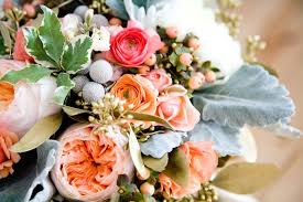 This summer hue inspires some of the loveliest wedding ideas, especially when paired with a warm gold accent bringing a romantic glow to any event. Peach Garden Rose Coral Ranunculus Grey Dusty Miller Brunia Gold Seeded Eucalyptus Wedding Flowers Gold Wedding Flowers Beach Wedding Flowers Wedding Flowers