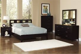 A living room set is an effective and convenient way to complete your living space, while eliminating the stress of matching sofas, chairs and ottomans. Downtown Queen Dark Brown Wooden Panel Bed Bedrooms Living Spaces Bedroom Sets Atmosphere Ideas Bronx Brooklyn Staten Island Por La Noche Queens Skyline Ny New York City Garden Apppie Org