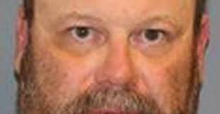 Man accused of aiming guns at his neighbors