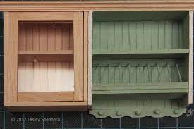 This upper cabinet comes with 3 drawers, 4 shelves, 6 pegs for hanging cups and 10 empty slots for plates. Miniatures Projects Tutorials Doll House Dollhouse Miniatures Kitchen Dollhouse Kitchen Cabinets