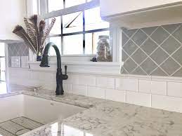 A straightedge or level can help you keep the tile even. Subway Tile And Diagonal Set Square Tile For Two Tone Classic Backsplash Square Tile Backsplash Unique Kitchen Backsplash Kitchen Tiles Backsplash