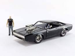 Here it is all the cars and other vehicles you will see in the film fast & furious. Amazon Com Jada Toys Fast Furious Dom Dodge Charger R T 1 24 Scale Black Die Cast Car With 2 75 Die Cast Figure Toys Games