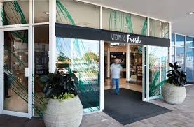 The Final Outcome Is A Cool And Understated Design That Establishes A Genuine Sense Of Place By Highlighting Beauty In Design Retail Design Retail Store Design
