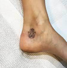Black Little Om Hamsa Tattoo On Ankle Hamsa Hand Tattoo Hamsa Tattoo Tattoos