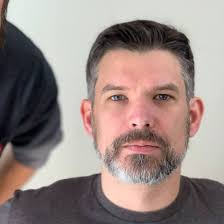 How many Nissan Titan owners have 100k+ miles without engine or  transmission issues and what are some suggestions for maintenance and  upkeep?