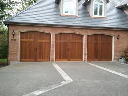 If you have a very small, simple home, you might be able to get away with a vinyl garage door costs starts at about $1,000 and goes up to $2,000 installed, depending on the size, quality and level of detailing you select. Carriage House Garage Doors Distribudoors