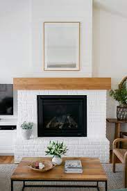 By painting each brick separately, this blogger maintained the texture but gave it a fresh look. Reclaimed Brick Fireplace Tutorial The Sommer Home