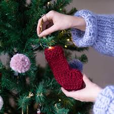 Display it on the mantle or stair railing as a gorgeous garland. Knit Kit Mini Stocking Garland Lauren Aston Designs