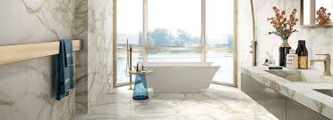 Offered in 2×24, 4×12, 12×24 and basketweave with dot decorative wavy tile in 12×24 surface bullnose 3×24. Calacatta Oro Marmi Marble Effect Porcelain Tiles