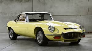 Equipment includes a black convertible top, chrome wire wheels, and a retrosound stereo. Jaguar E Type Series 3 V12 Review Improving The Classic Jaguar E Type Is A Tall Order But A Kent Based Company Has Done Just That Cityam Cityam