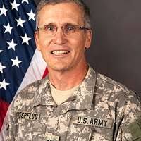 Col. Nathan Green stands after being appointed commander