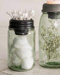 Small bathroom storage timber on the wall with plenty of towels rolled up brown and white. 10 Ways That Mason Jars Make The Best Bathroom Storage